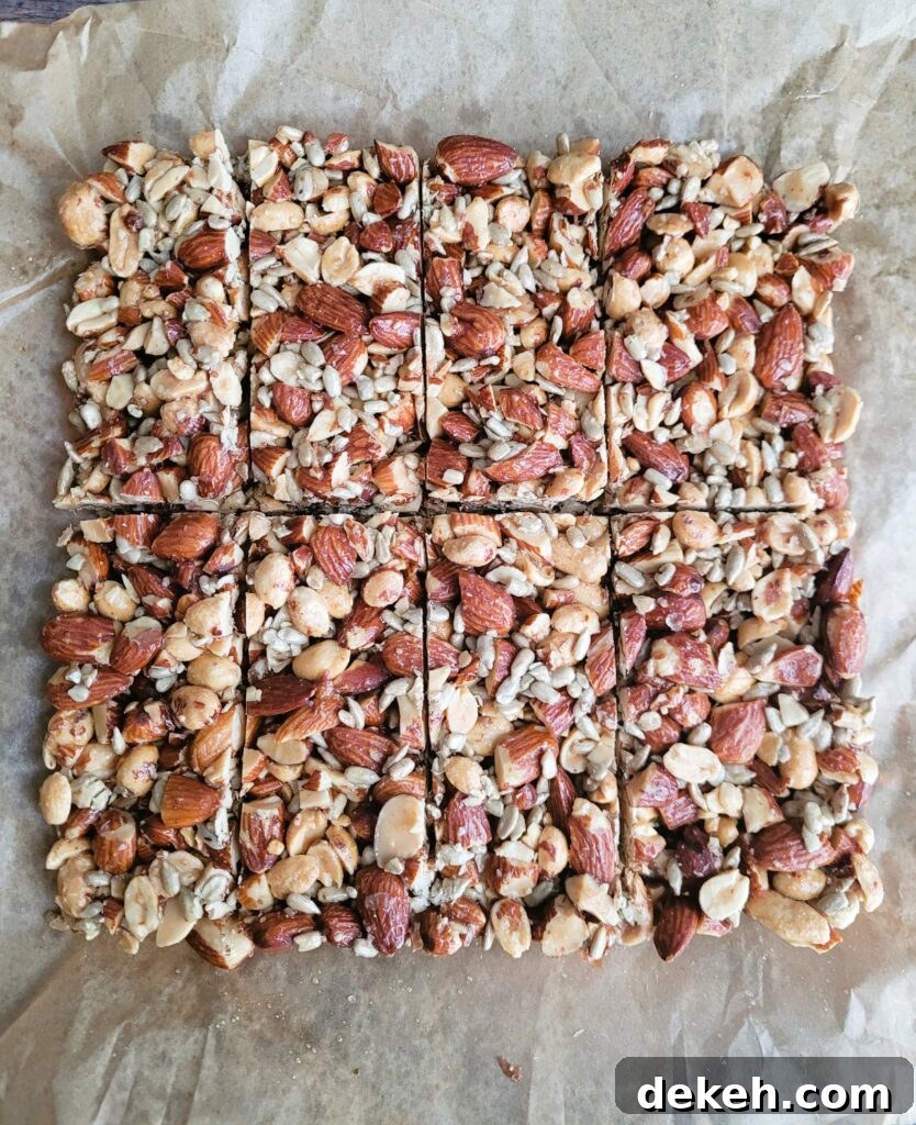 Crunchy Homemade Nut Bars: Step-by-Step Recipe 8 Tray of homemade almond crunch bars cut into squares, ready to snack.