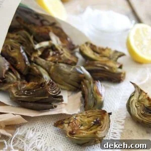 Roasted baby artichokes served with lemon and salt.