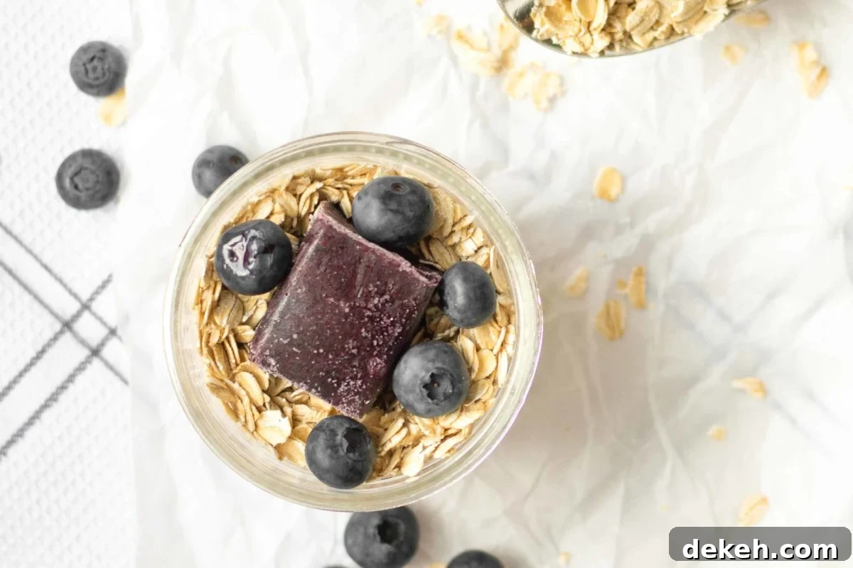 overnight oats with blueberry puree and whole blueberries on top