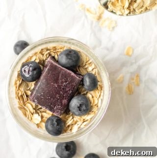 overnight oats with blueberry puree and whole blueberries on top