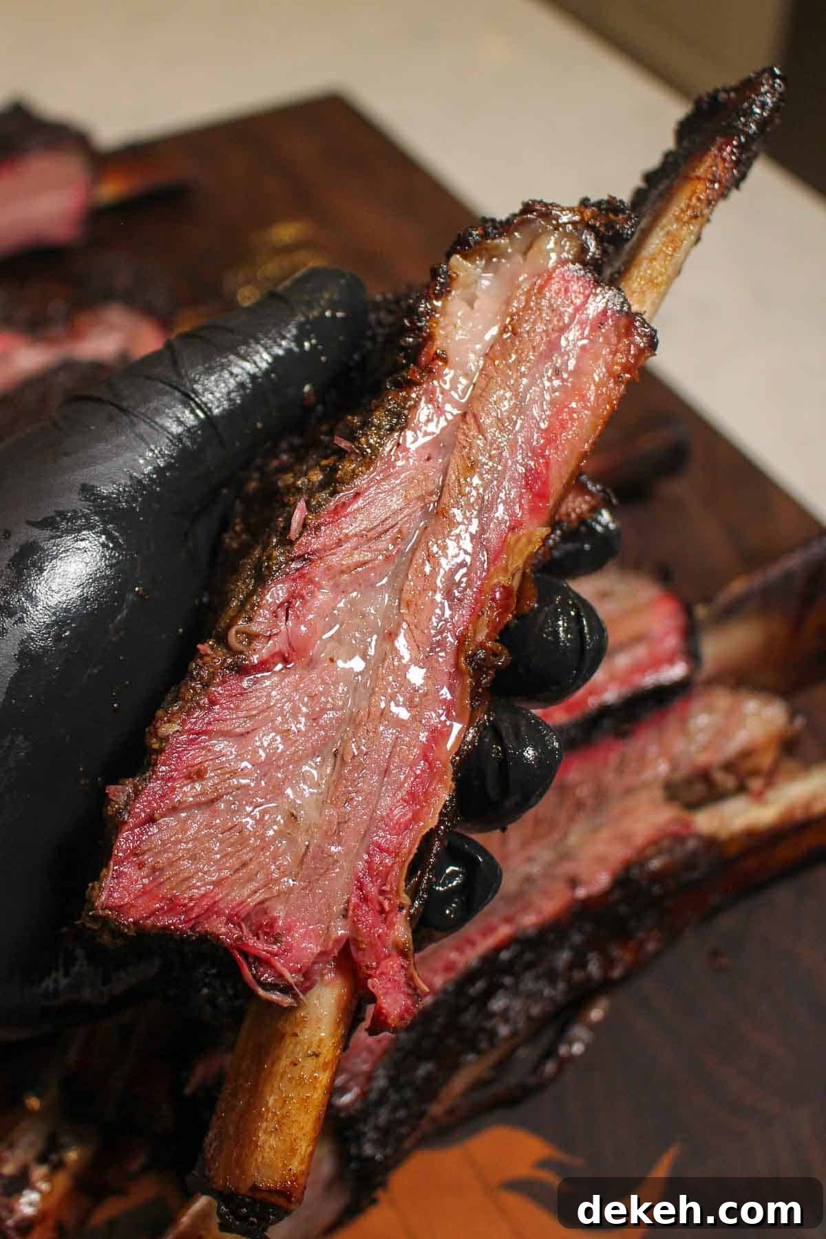Smoked Beef Ribs with Garlic and Jalapeño 3 A close up shot of one of the sliced smoked garlic jalapeno beef ribs.