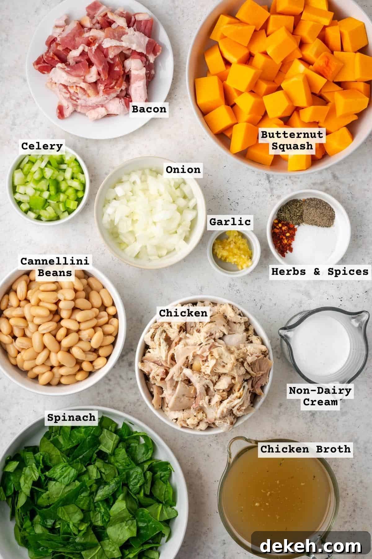 Creamy Chicken and Butternut Squash Soup Recipe 3 Ingredients for a creamy chicken butternut squash soup on a white table.
