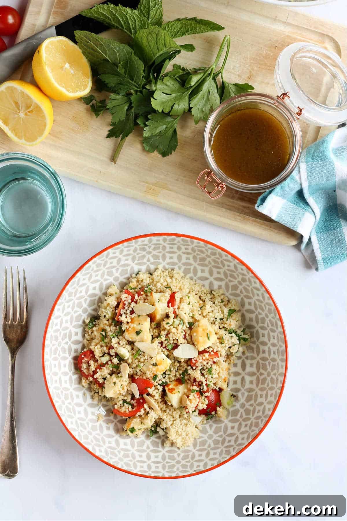 Herbed Couscous and Halloumi Salad with Lemon Dressing 6 Overhead shot of couscous salad with salad dressing.