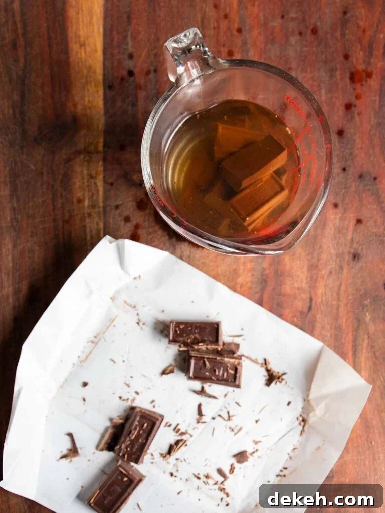 Original Baker's German Chocolate Cake Recipe 5 Chocolate squares in a glass measuring cup with boiling water.