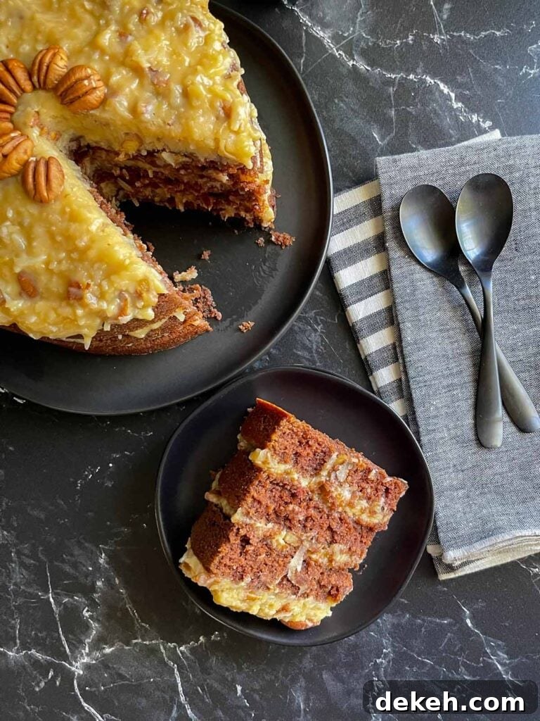 Original Baker's German Chocolate Cake Recipe 8 A slice of original Baker's German Chocolate Cake on a black plate.