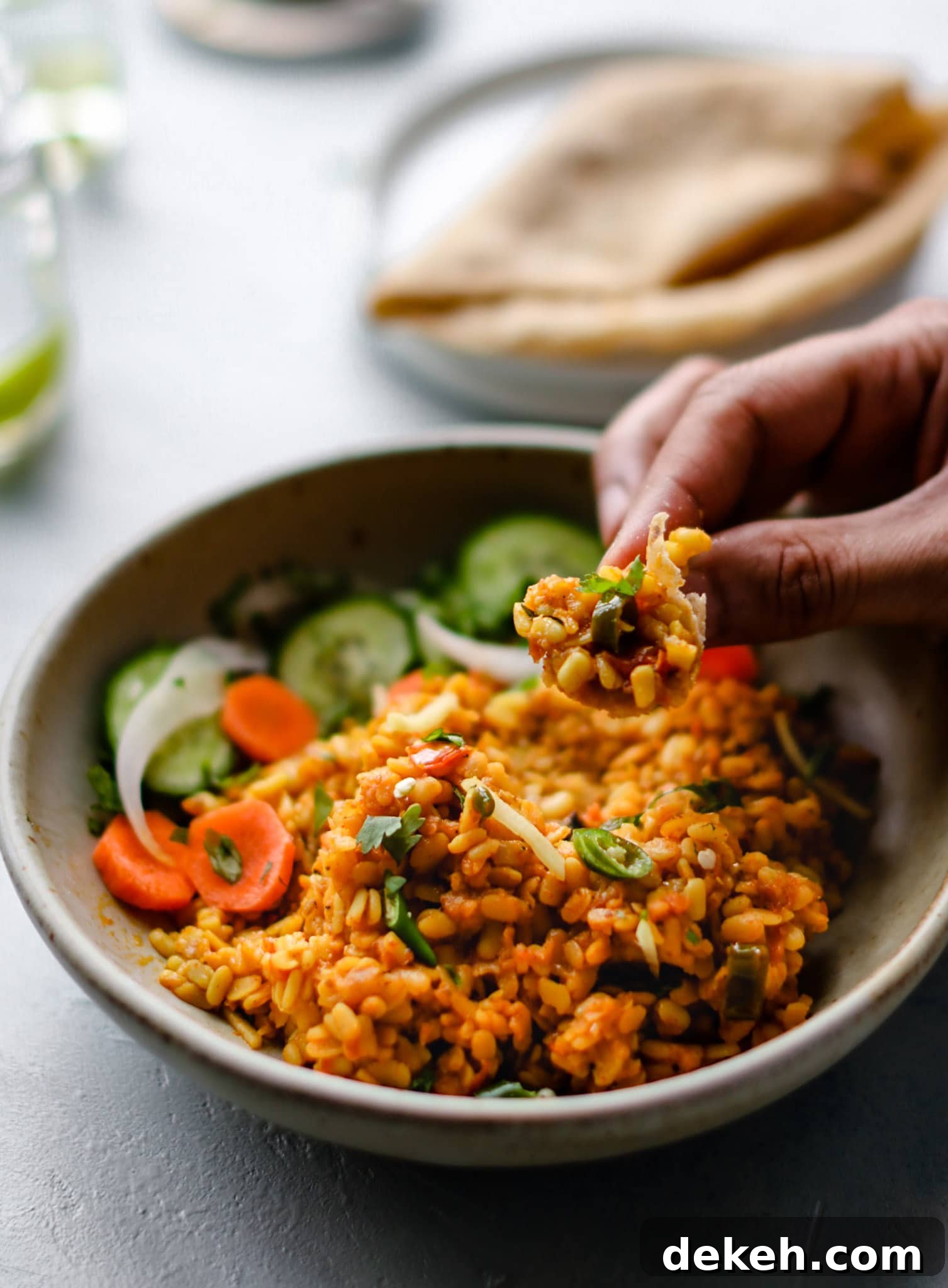 Authentic Pakistani Maash (Urad) Dal Recipe 6 Picking up some Mash ki Daal (Urad Dal) with a small piece of roti.