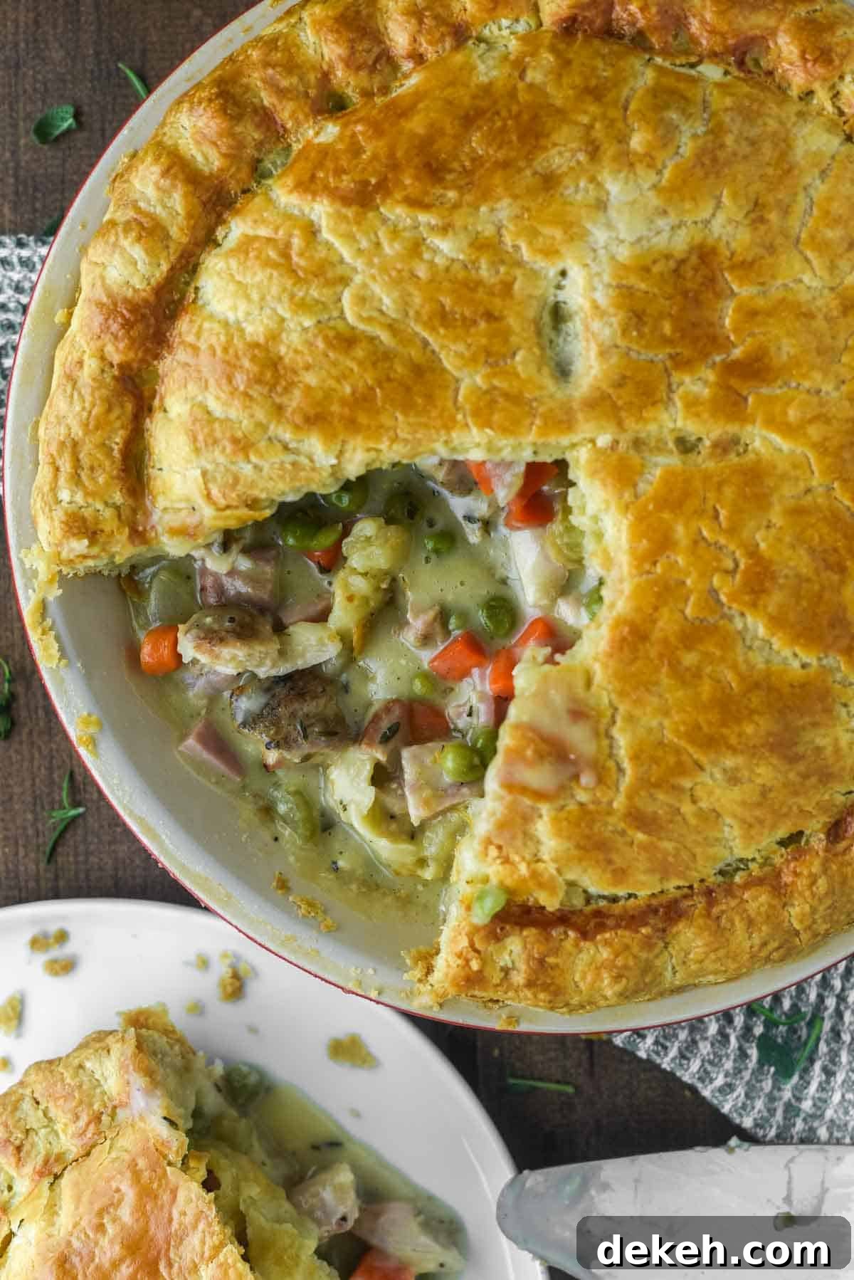 Classic Chicken and Ham Pie with Golden Puff Pastry 2 overhead shot of slice taken out of chicken and ham pie
