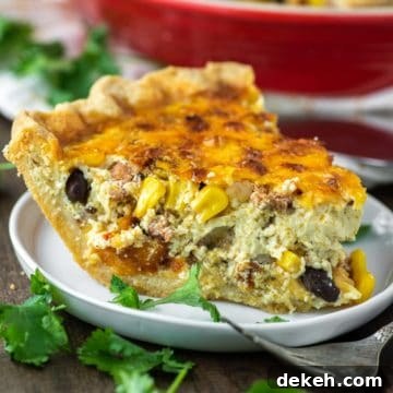 slice of chorizo quiche in white plate