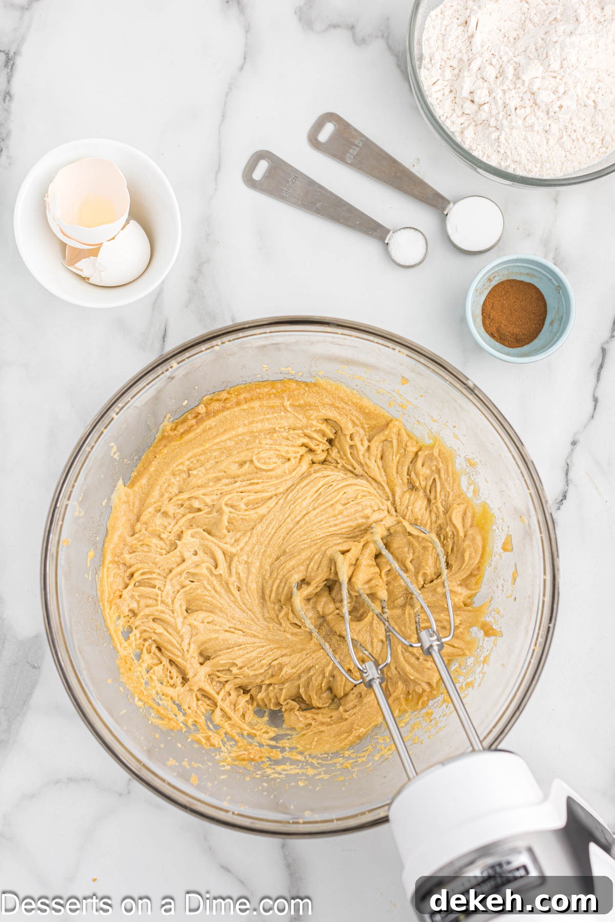 Moist Oatmeal Cake with Cinnamon Streusel 5 Bowl with electric mixer combining butter and both sugars.