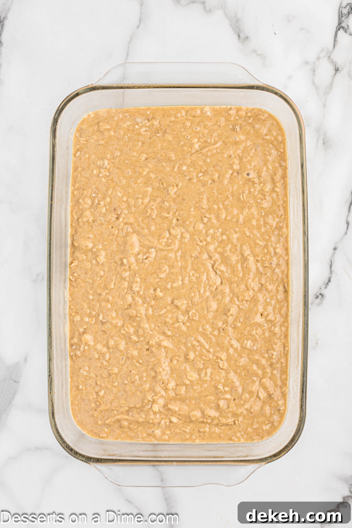 Moist Oatmeal Cake with Cinnamon Streusel 8 Baking pan with cake mixture spread evenly.
